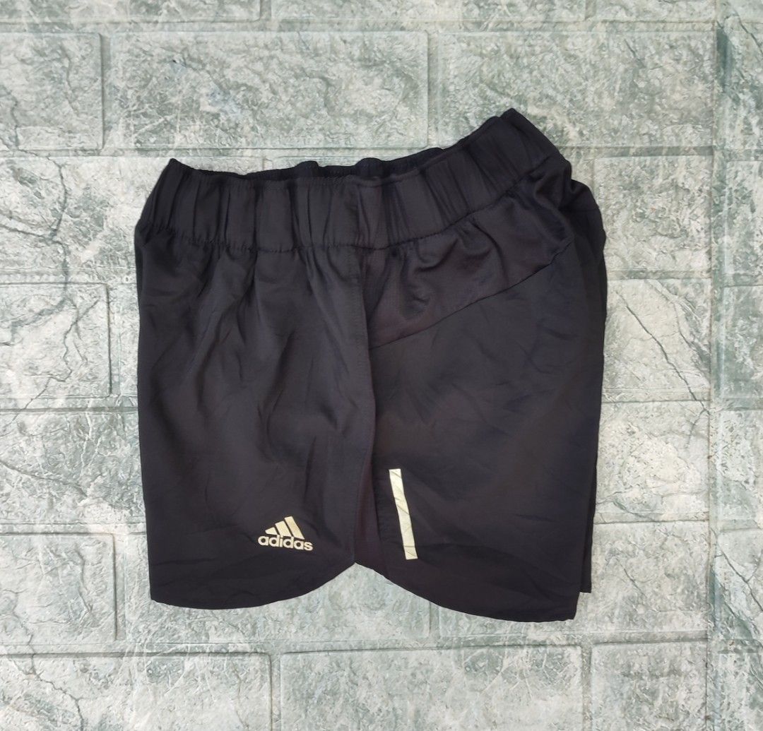 Adidas Response Climacool Running Shorts (Category: Shorts) located in Bayambang. Submitted by mon10192816 (Listing ID 1465873534, Image 1). Description: - Waist 24-29 - Length 11.5 - Issue Missing Drawstring - Brand: Adidas - Color: Black - Technology: Climacool for breathability - Features: Elastic waistband, secure side zip pocket, and reflective branding - Material: Lightweight and comfortable - Fit: Standard fit, easy to pair with any sports