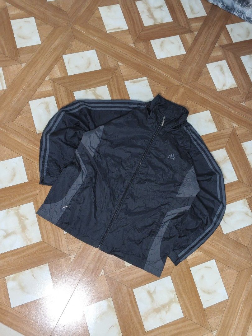 Adidas Special Style Black Track Jacket Size L (Category: Coats, Jackets and Outerwear) located in Manila. Submitted by dp.finds (Listing ID 1465766322, Image 1). Description: - Brand: Adidas Special Style - Color: Black with grey side panels and signature stripes - Size: L - Material: Lightweight windbreaker - Features: Full zip closure with metal pull and high collar - Condition: Great for training or casual everyday wear - Location: Ships from