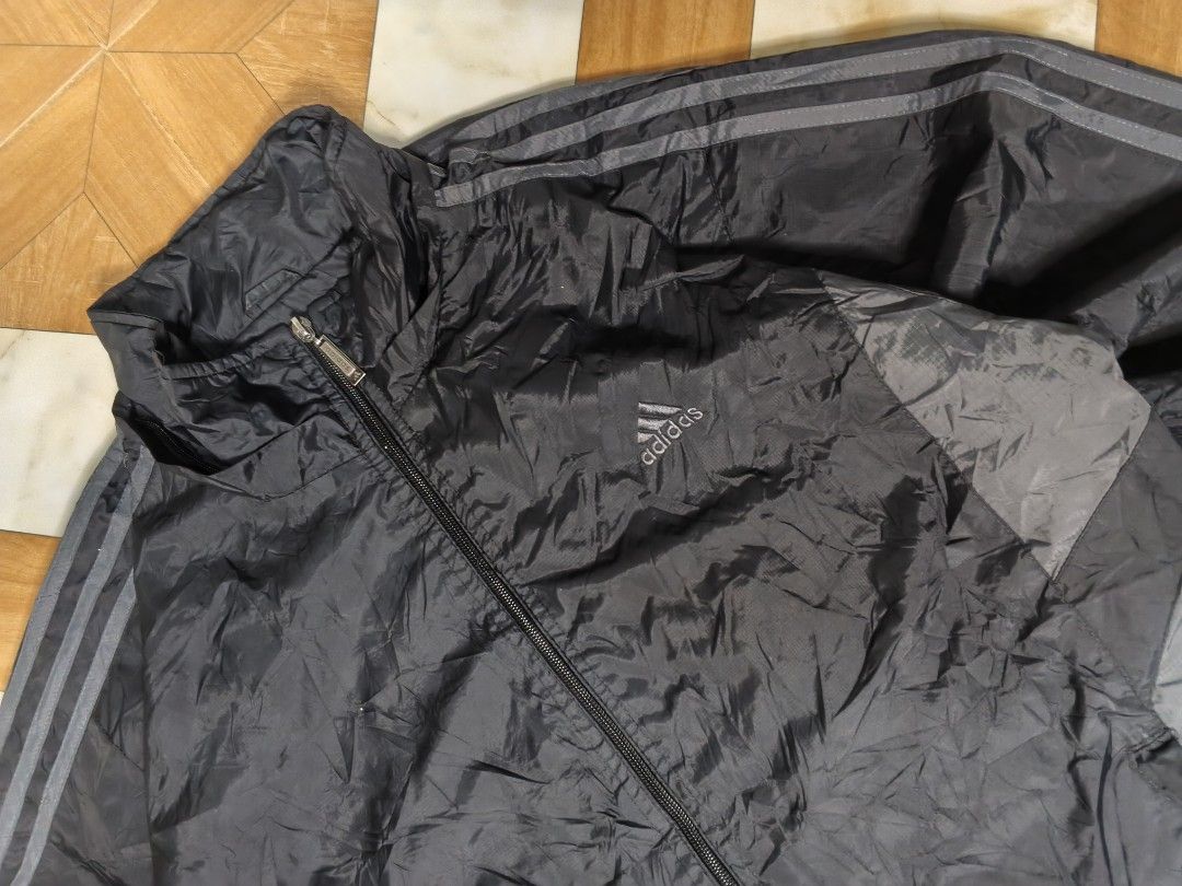Adidas Special Style Black Track Jacket Size L (Category: Coats, Jackets and Outerwear) located in Manila. Submitted by dp.finds (Listing ID 1465766322, Image 3). Description: - Brand: Adidas Special Style - Color: Black with grey side panels and signature stripes - Size: L - Material: Lightweight windbreaker - Features: Full zip closure with metal pull and high collar - Condition: Great for training or casual everyday wear - Location: Ships from