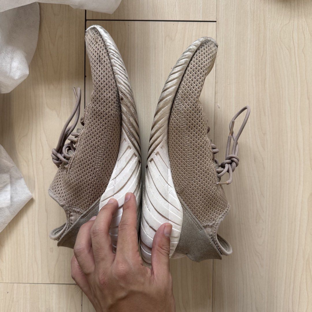 Adidas Tubular Doom Sneaker Beige (Category: Sneakers) located in Manila. Submitted by costephen (Listing ID 1465811565, Image 2). Description: - Brand/Model: Adidas Tubular Doom - Color: Beige with white sole - Material: Mesh upper with suede lacing cage - Design: Iconic ribbed tire-inspired sole and sock-like slip-on collar - Condition: Uppers in solid shape, normal dirt marks on white midsoles from regular wear - Closure: Lace-up.