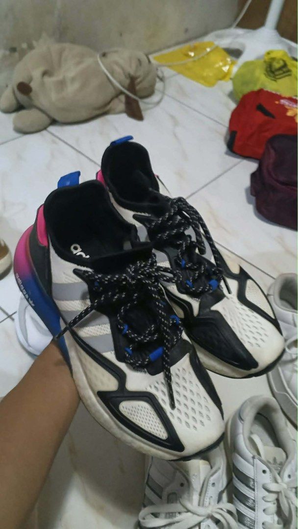Adidas ZX 2K Boost FX8835 (Category: Sneakers) located in Manila. Submitted by oddpenguin_cc96b9 (Listing ID 1465899730, Image 3). Description: - Brand: Adidas - Model: ZX 2K Boost (FX8835) - Colorway: White mesh upper, black overlays, grey stripes, with a vibrant blue and pink gradient midsole - Features: Black patterned laces with blue lace loops, highly responsive cushioning for daily wear - Condition: Pre-loved, worn a few times with slight d