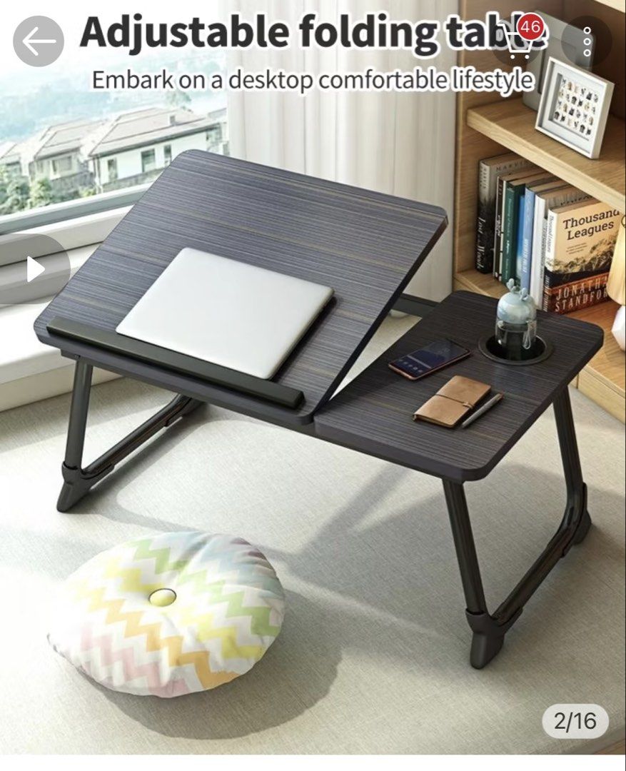 Adjustable Folding Laptop Desk Bed Table Wood Grain (Category: Tables & Sets) located in Taguig. Submitted by criseldamanalo (Listing ID 1465816901, Image 1). Description: - Multi-functional folding bed table with sleek dark wood grain top - Adjustable tilting side with stop bar, perfect for laptops and reading - Flat side features a built-in cup holder and convenient slot for phones or stationery - Sturdy foldable legs allow for easy storage und