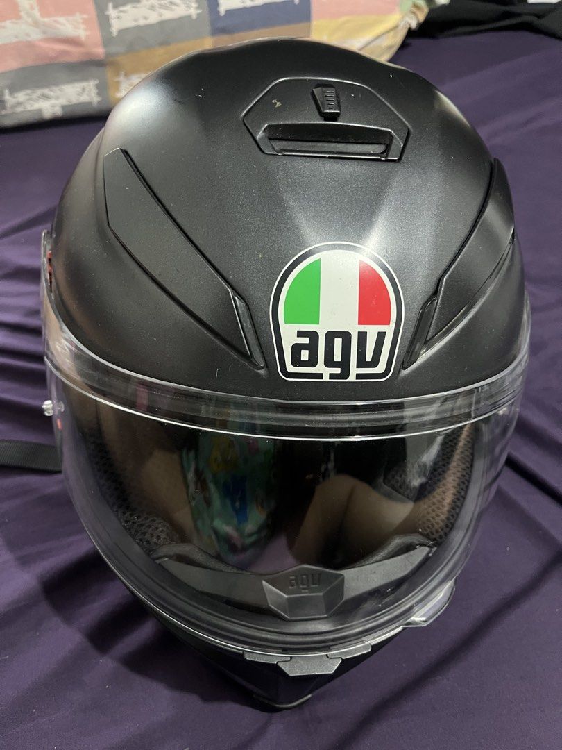 AGV Matte Black Motorcycle Helmet with Clear Visor (Category: Helmets and other Riding Gears) located in Bayawan. Submitted by airahmay1012 (Listing ID 1465809194, Image 3). Description: - Authentic AGV motorcycle helmet in sleek matte black - Smooth-operating clear visor - Stylish red trim interior with breathable black mesh panels - Standard secure buckle strap for a safe, snug fit - Ideal for daily city commutes or weekend road trips.