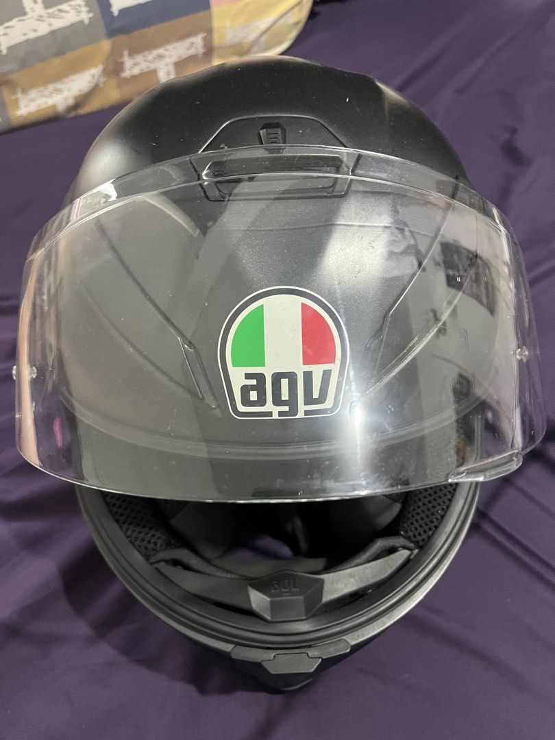 AGV Matte Black Motorcycle Helmet with Clear Visor (Category: Helmets and other Riding Gears) located in Bayawan. Submitted by airahmay1012 (Listing ID 1465809194, Image 2). Description: - Authentic AGV motorcycle helmet in sleek matte black - Smooth-operating clear visor - Stylish red trim interior with breathable black mesh panels - Standard secure buckle strap for a safe, snug fit - Ideal for daily city commutes or weekend road trips.