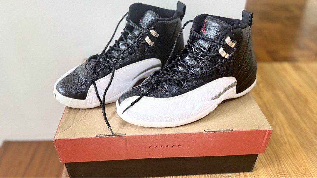 Air Jordan 12 Retro 'Playoff' 2022 (Category: Sneakers) located in Manila. Submitted by zabelshoppe (Listing ID 1465947309, Image 2). Description: - Model: Air Jordan 12 Retro - Colorway: Black and White with Red Jumpman logo and metallic silver eyelets - Size: US 11 - Condition: Clean outsoles and crisp uppers - Inclusion: Comes with original Jordan shoebox - Ideal for daily wear or sneaker collectors.