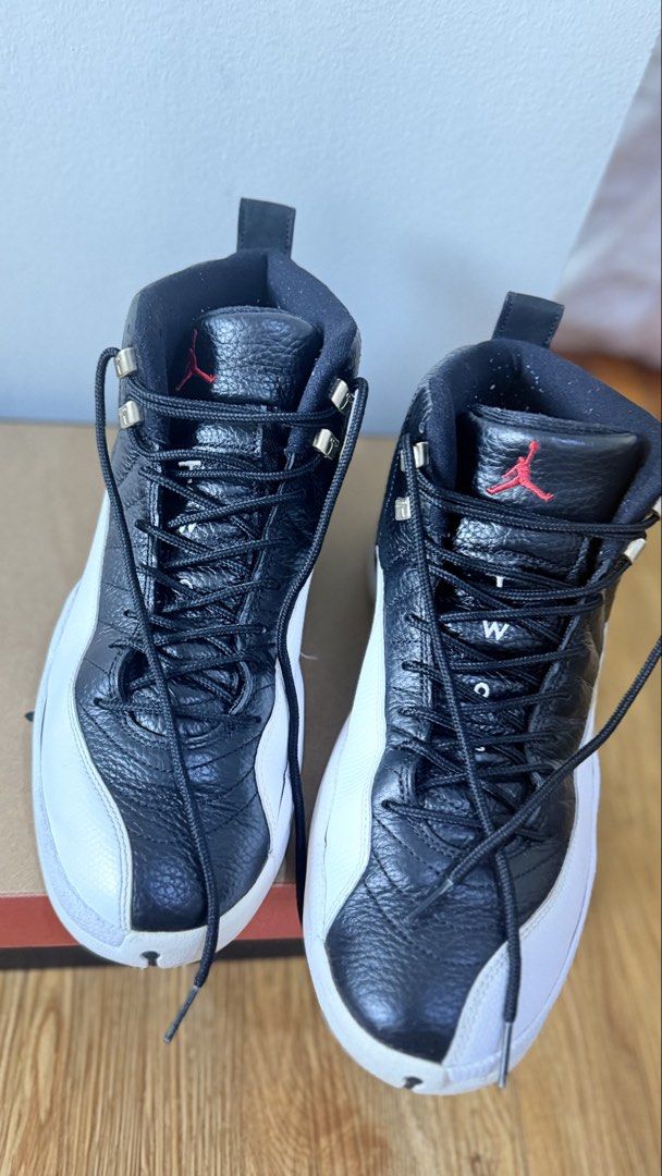 Air Jordan 12 Retro 'Playoff' 2022 (Category: Sneakers) located in Manila. Submitted by zabelshoppe (Listing ID 1465947309, Image 3). Description: - Model: Air Jordan 12 Retro - Colorway: Black and White with Red Jumpman logo and metallic silver eyelets - Size: US 11 - Condition: Clean outsoles and crisp uppers - Inclusion: Comes with original Jordan shoebox - Ideal for daily wear or sneaker collectors.