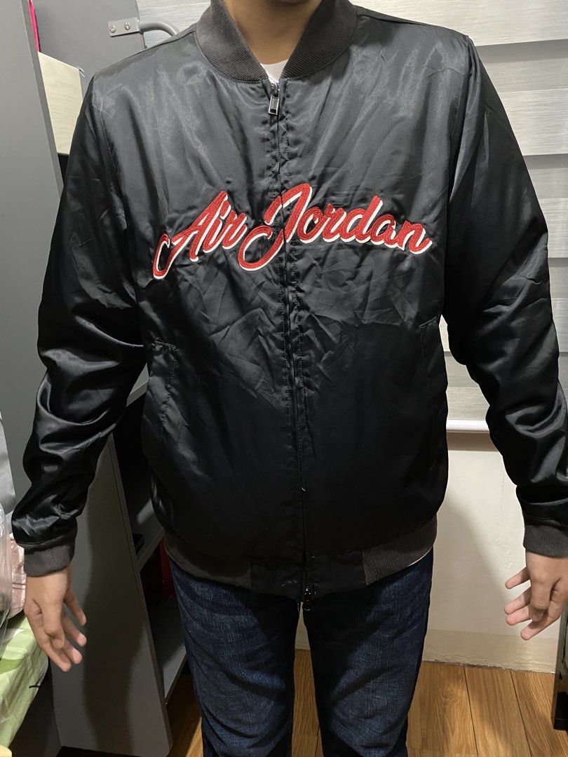 Air Jordan Black Bomber Jacket (Category: Coats, Jackets and Outerwear) located in Butuan. Submitted by nielben13 (Listing ID 1465901492, Image 2). Description: - Brand: Jordan - Item: Black bomber jacket with red embroidered cursive 'Air Jordan' lettering - Details: Full zip front, ribbed collar and cuffs, two front pockets - Size: Tagged P (fits like Small to Medium based on 18" x 25" measurements) - No issue Solid sa personal .