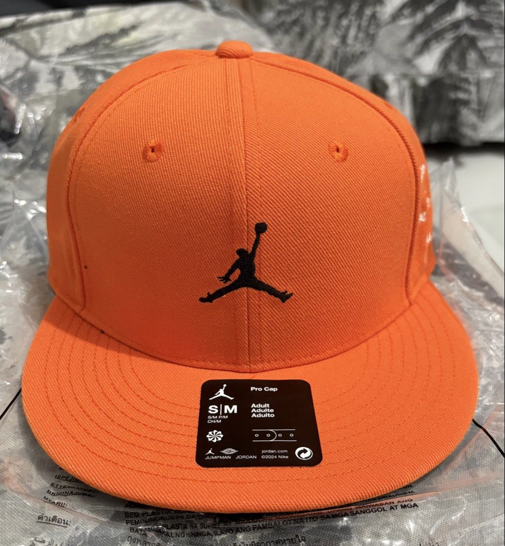 Air Jordan Pro Structured Hat S/M (Category: Caps & Hats) located in Manila. Submitted by shoepatos4u (Listing ID 1465897678, Image 1). Description: Brand: Air Jordan Product Code: HV1068-805 Colorway: Starfish/Black/Black Main Color: Orange • Fit and Style: Max-depth, structured crown design with a flat brim for a traditional baseball look. • Closure: Adjustable snapback closure at the rear for a custom, secure fit. • Details: Premium embroidere