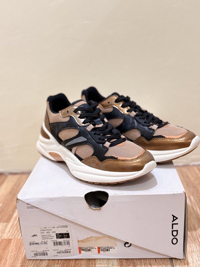 ALDO Createv2 Sneakers (Category: Sneakers) located in Quezon City. Submitted by cndcvrtc (Listing ID 1465938484, Image 1). Description: - Brand: ALDO - Model: Createv2 Chunky Sneakers - Colorway: Mix of bronze, black, and nude tones - Size: US 7 / EU 37.5 - Features: Lace-up closure with black laces and thick white soles - Inclusions: Original shoe box included - Condition: Great casual everyday footwear.