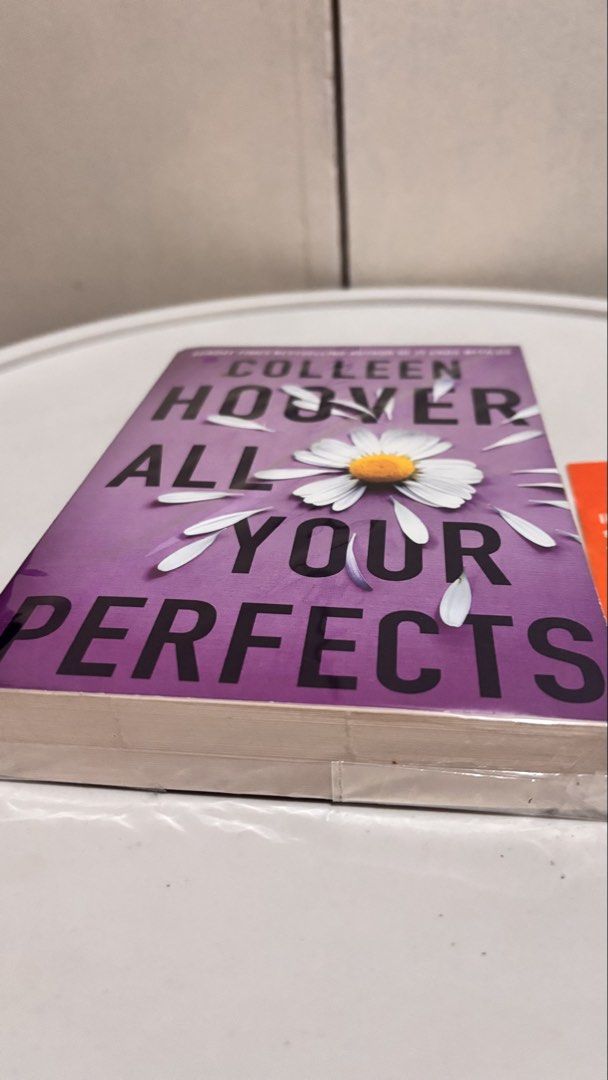 All Your Perfects by Colleen Hoover (Category: Storybooks) located in Taguig. Submitted by lizzyhernandez (Listing ID 1465948890, Image 2). Description: - Title: All Your Perfects by Colleen Hoover - Edition: Paperback with purple daisy cover - Condition: Lightly used, sealed in plastic protective film - Source: Purchased from Amazon UK - Genre: Emotional romance / contemporary fiction.