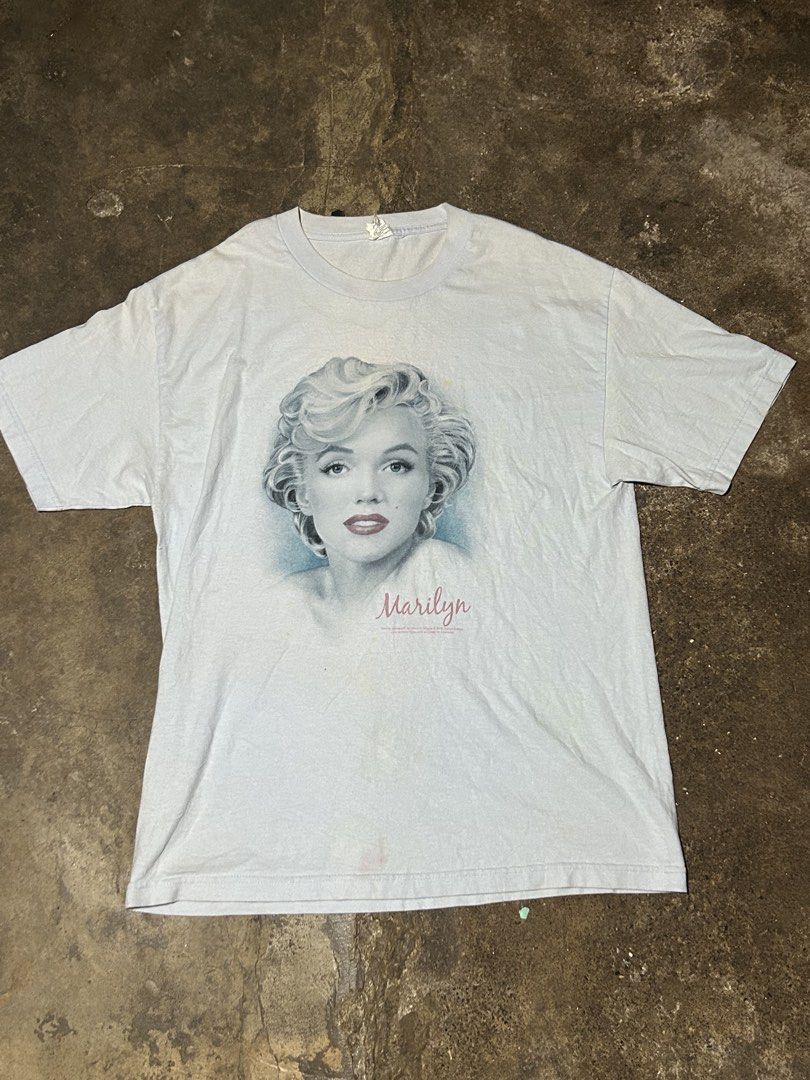 Alstyle Marilyn Monroe Graphic Tee (Category: Shirts) located in Bacolod City. Submitted by reens14 (Listing ID 1465890258, Image 1). Description: - Brand: Alstyle Apparel & Activewear - Design: Marilyn Monroe portrait graphic print on front - Color: Light blue - Style: Classic short sleeve crewneck t-shirt - Condition: Excellent.