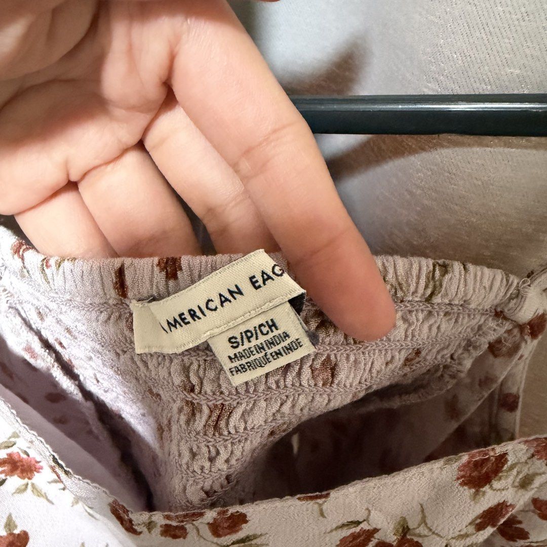 American Eagle Floral Patchwork Skirt (Category: Sets or Coordinates) located in Makati City. Submitted by heyitsg_ (Listing ID 1465807047, Image 3). Description: - Brand: American Eagle - Style: Matching cami and asymmetric skirt set - Print: Mixed floral patchwork in pastel tones (peach, sage green, dusty mauve) - Size: S - Top: Thin straps, cropped, and smocked fit - Skirt: High-low ruffled hemline with a pull-on waist - Origin: Made in India 
