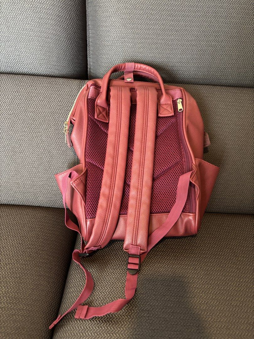 Anello Leather Backpack Red (Category: Backpacks) located in Quezon City. Submitted by bingbnb (Listing ID 1465773272, Image 3). Description: - Brand: Anello - Color: Rich burgundy with chic gold-tone hardware - Material: leather - Design: Iconic structured wide-mouth main compartment for easy packing - Pockets: Front zip pocket, side slip pockets, and interior slip pockets - Comfort: Padded mesh back panel and adjustable shoulder straps.