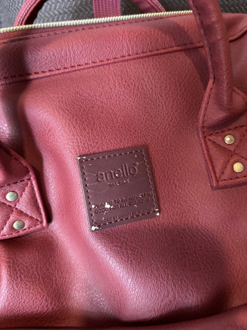 Anello Leather Backpack Red (Category: Backpacks) located in Quezon City. Submitted by bingbnb (Listing ID 1465773272, Image 2). Description: - Brand: Anello - Color: Rich burgundy with chic gold-tone hardware - Material: leather - Design: Iconic structured wide-mouth main compartment for easy packing - Pockets: Front zip pocket, side slip pockets, and interior slip pockets - Comfort: Padded mesh back panel and adjustable shoulder straps.