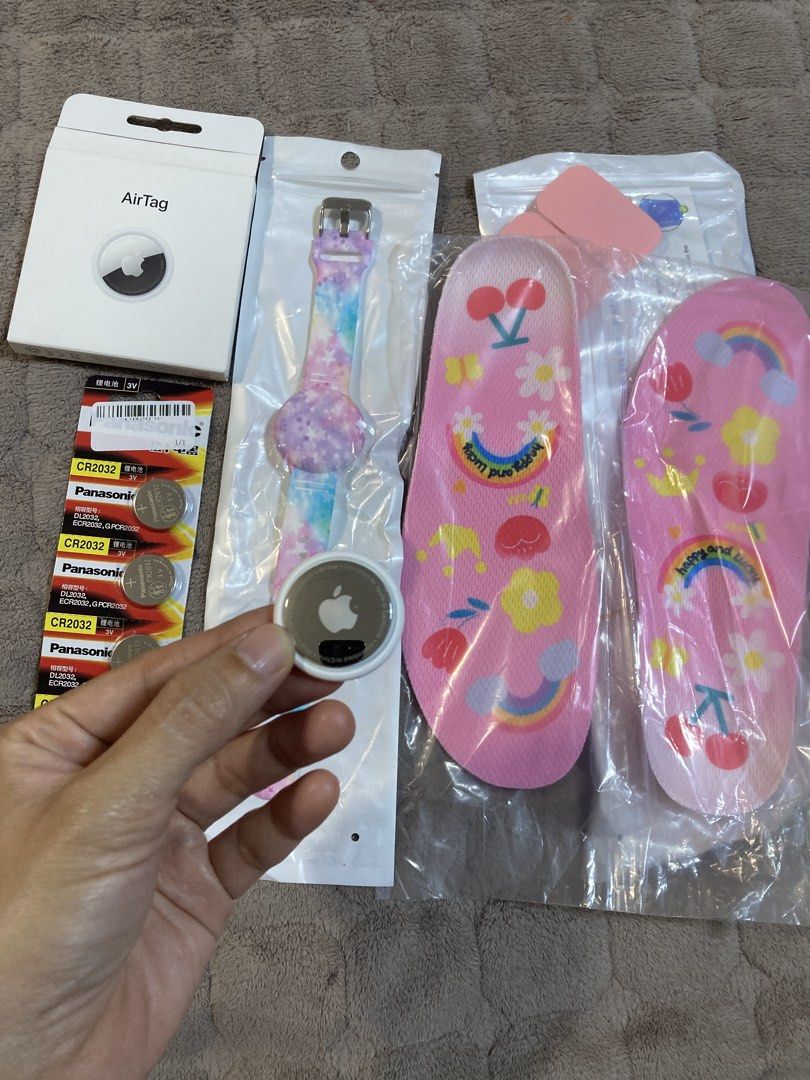 Apple AirTag 1 Pack with Accessories (Category: Wearables & Smart Watches) located in Quezon City. Submitted by queerlady (Listing ID 1465818905, Image 2). Description: - Apple AirTag single pack in original box (unused) - Includes a cute multicolor pastel strap holder - Bonus pack of Panasonic CR2032 lithium batteries included - Comes with stylish pink patterned shoe insoles - Great all-in-one bundle for tracking keys, bags, and more - Ships fas