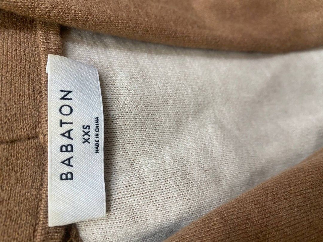 Aritzia Babaton Lance Cardigan (Category: Coats, Jackets and Outerwear) located in Manila. Submitted by lovelypreloved1497 (Listing ID 1465877685, Image 3). Description: - Brand/Style: Babaton Lance Long Cardigan - Color: Camel brown with contrasting light beige inside - Size: XXS but fits up to medium size - Design: Open front, long sleeves, and two front patch pockets - Material: Soft, cozy knit - Extra: Includes original extra yarn card attach