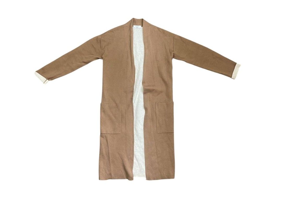 Aritzia Babaton Lance Cardigan (Category: Coats, Jackets and Outerwear) located in Manila. Submitted by lovelypreloved1497 (Listing ID 1465877685, Image 2). Description: - Brand/Style: Babaton Lance Long Cardigan - Color: Camel brown with contrasting light beige inside - Size: XXS but fits up to medium size - Design: Open front, long sleeves, and two front patch pockets - Material: Soft, cozy knit - Extra: Includes original extra yarn card attach