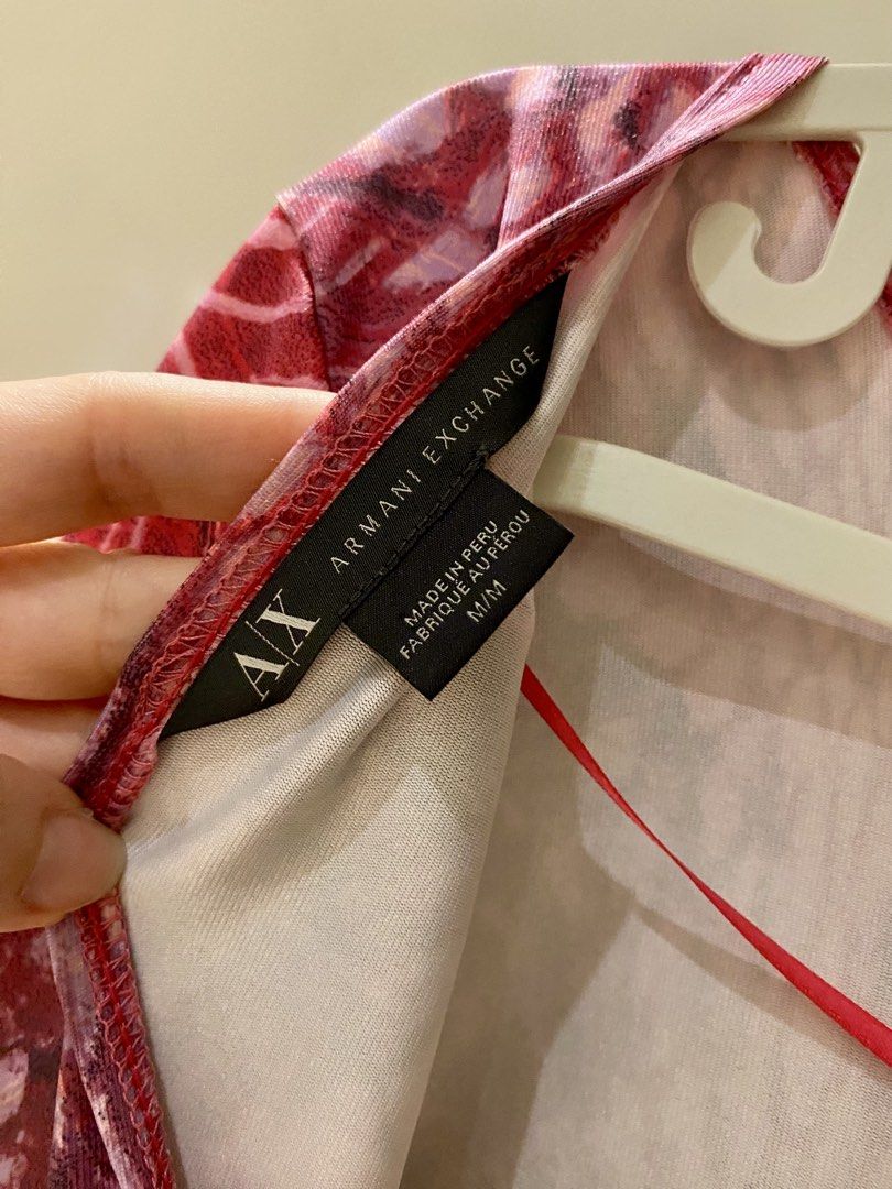 Armani Exchange Pink Patterned Long Sleeve Dress Size M (Category: Dresses) located in Pasig City. Submitted by clloisbox (Listing ID 1465882939, Image 3). Description: - Brand: Armani Exchange - Size: M - Design: Pink and red abstract pattern all over - Features: Long sleeves, scoop back neckline, soft stretchy material - Origin: Made in Peru - Condition: Great statement piece for nights out or parties - Shipping: Ships fast from the Philippines