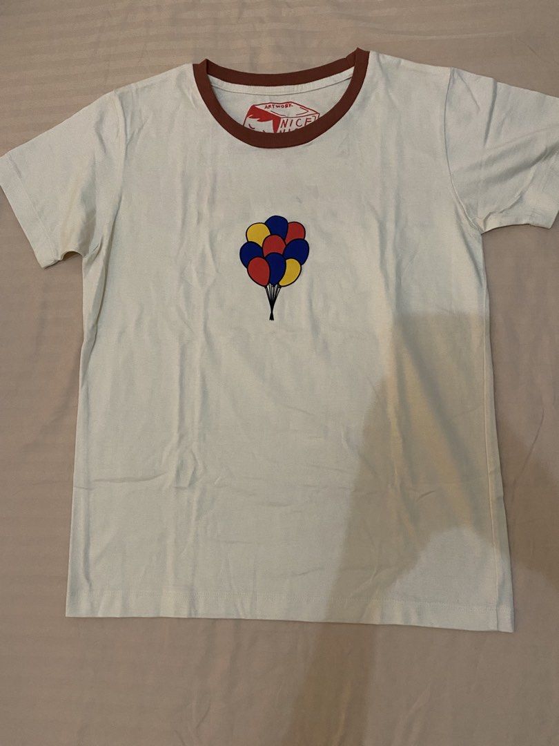 Artwork Balloon Ringer T-Shirt Size M (Category: Shirts) located in Cebu City. Submitted by hailey_sells (Listing ID 1465823165, Image 1). Description: RUSSEL UP HALLOWEEN COSTUME IDEA - Color: Off-white with brown collar trim - Design: Small balloon graphic on chest, large text on the back - Material: Soft and breathable cotton.