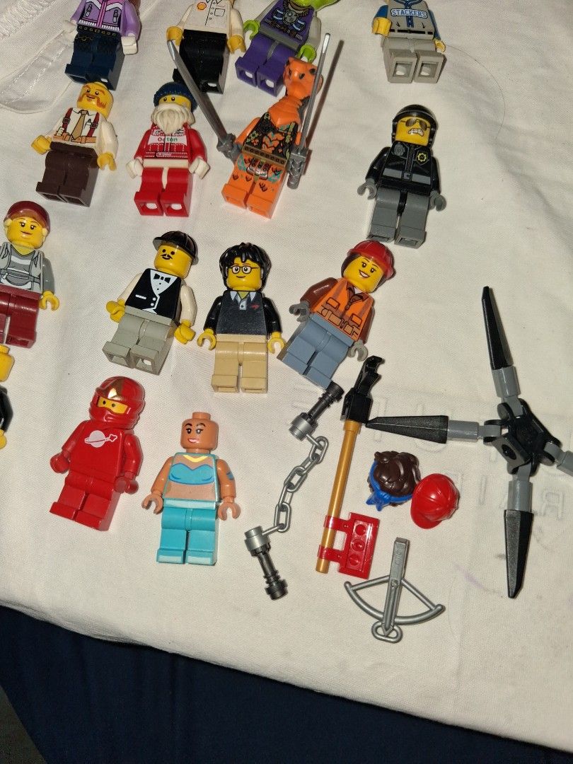 Assorted LEGO Minifigures and Accessories Bundle (Category: Lego & Building Sets) located in Manila. Submitted by marcas022798212 (Listing ID 1465892390, Image 3). Description: - LEGO Minifigure & Accessory Bundle: Assorted figures including ninjas, construction workers, and a frog alien - Weapons & Gear: Includes various swords, a crossbow, chain elements, and spare hats - Condition: Pre-loved, well-kept, great for expanding collections - Perfec
