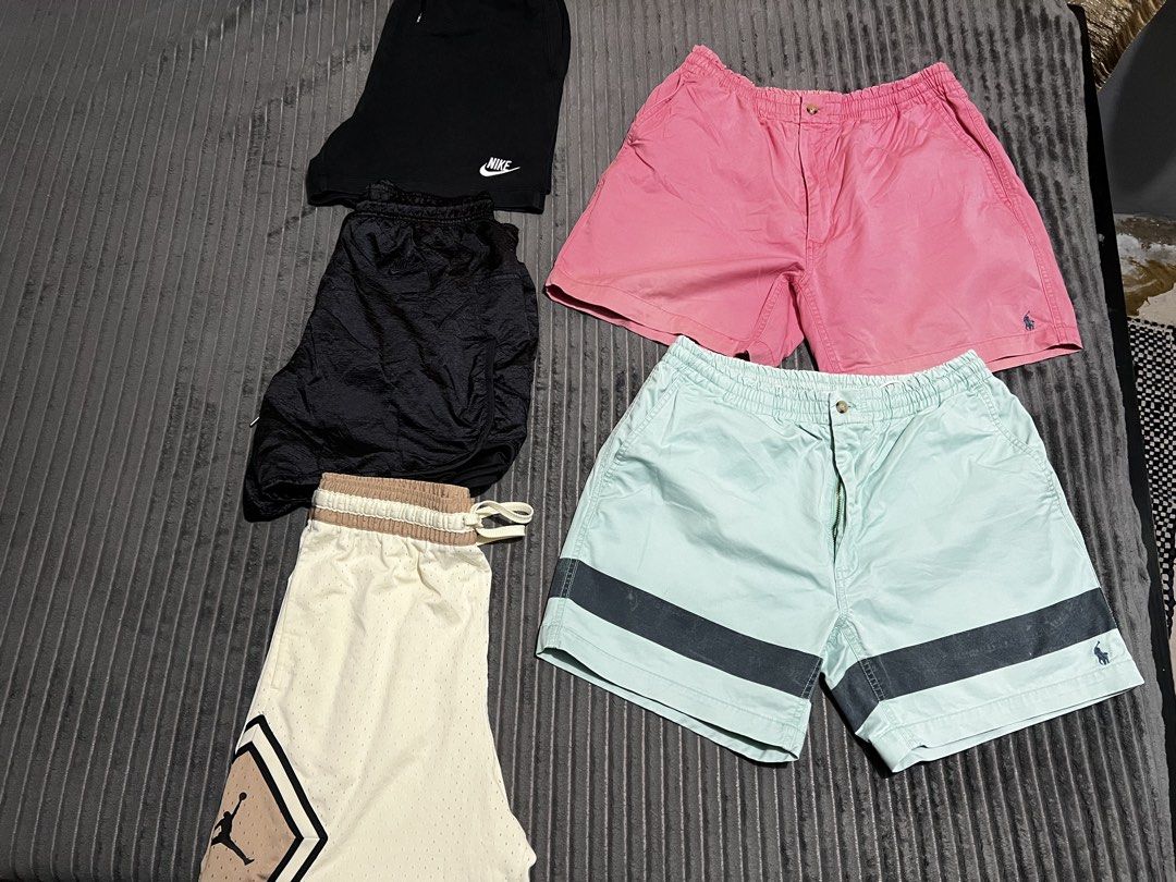 Assorted Shorts Bundle Nike Jordan Polo Ralph Lauren (Category: Shorts) located in Manila. Submitted by johnnytapiajr45 (Listing ID 1465797729, Image 1). Description: - Bundle of 5 casual and athletic shorts - 1x Pink Polo Ralph Lauren chino shorts (button waistband) - 1x Light blue Polo Ralph Lauren chino shorts (button waistband) - 1x Black Nike swoosh sweat shorts - 1x Black crinkled nylon athletic shorts (with drawstrings) - 1x Cream/tan Jord
