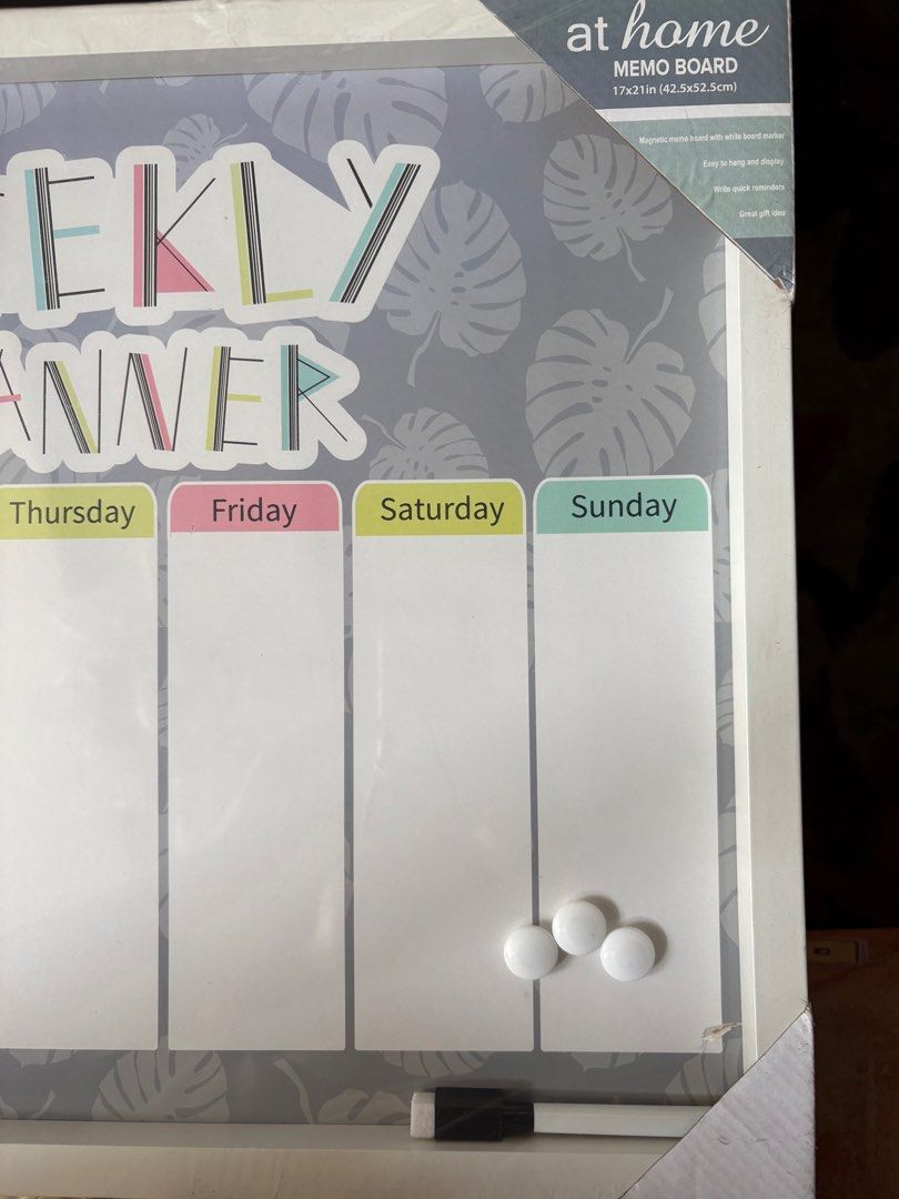 At Home Weekly Planner Memo Board White Frame (Category: Stationery & School Supplies) located in Makati City. Submitted by chestful.of.treasures (Listing ID 1465805247, Image 2). Description: - Brand: At Home - Design: Tropical leaf pattern with weekly planner layout - Size: 17x21 inches (42.5x52.5cm) - Frame: White wooden frame - Inclusions: 1 white marker with eraser cap and 3 white magnetic buttons - Condition: Brand new, still wrapped in ori