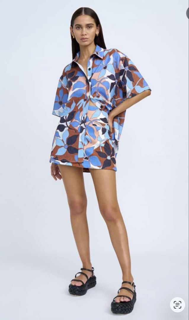 AU brand By Johnny coords set (Category: Sets or Coordinates) located in Manila. Submitted by scimihx (Listing ID 1465907409, Image 2). Description: - Brand: By Johnny - Style: Two-piece set (short-sleeve button-down shirt and matching mini skirt) - Print: Mornings in Colour (blue, brown, black, and white floral pattern) - Condition: Worn once for a quick photo shoot, basically untouched/like new - Ideal for: Warm weather days - Note: Selling as 