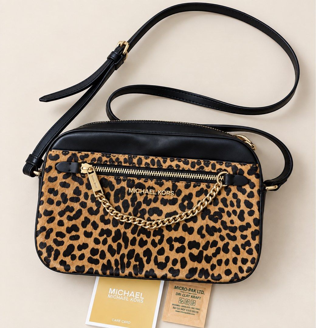 Aunthentic MK (Category: Cross-body Bags) located in General Santos City (Dadiangas). Submitted by jaqs87 (Listing ID 1465854899, Image 1). Description: Original Michael Kors Leopard Print Crossbody Bag 🖤🤎 ✨ Authentic / Original ✨ Good condition ✨ With original care card/tag ✨ No original dust bag, but I will provide a dust bag for protection/storage ✨ Leopard print with black leather trim & gold hardware ✨ Adjustable crossbody strap.