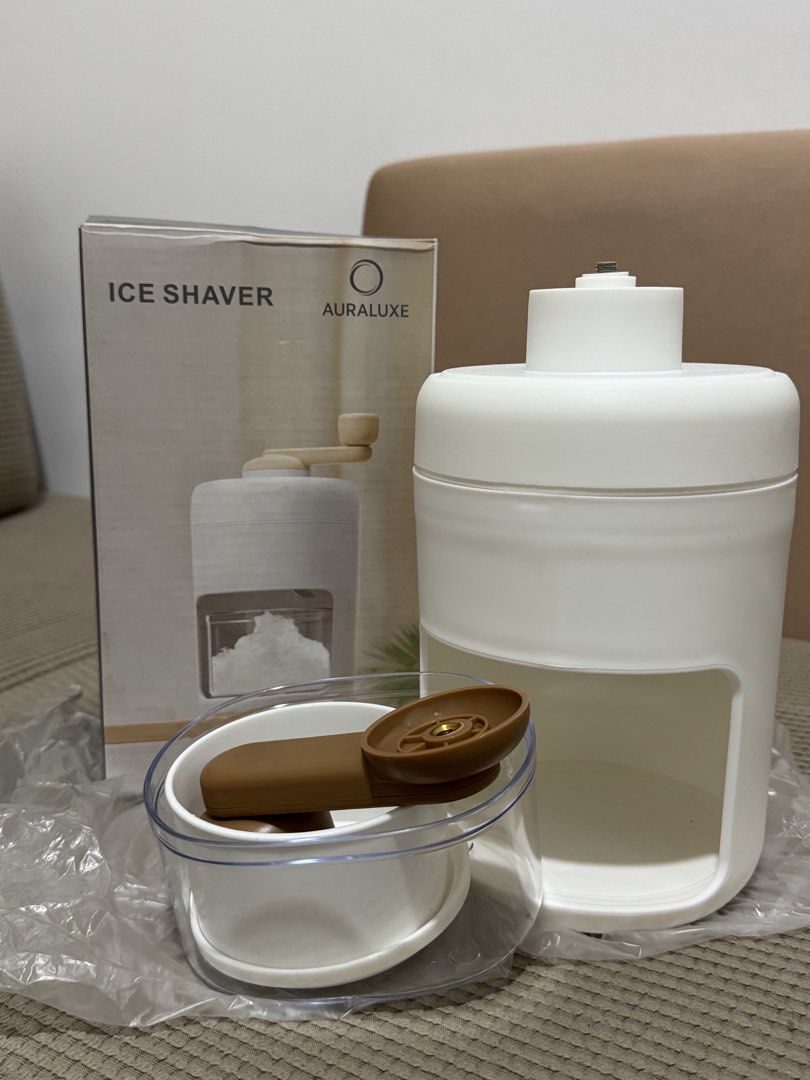Auraluxe Ice Shaver (Category: Juicers, Blenders & Grinders) located in Manila. Submitted by kelbinooo (Listing ID 1465931022, Image 2). Description: - Brand: Auraluxe manual ice shaver machine - Colorway: Clean white with stylish brown handle components - Condition: Unused, opened only to take photos - Inclusions: Main body unit, clear collection container, inner mold cup, turning handle, and original retail box - Usage: Perfect for making cafe-