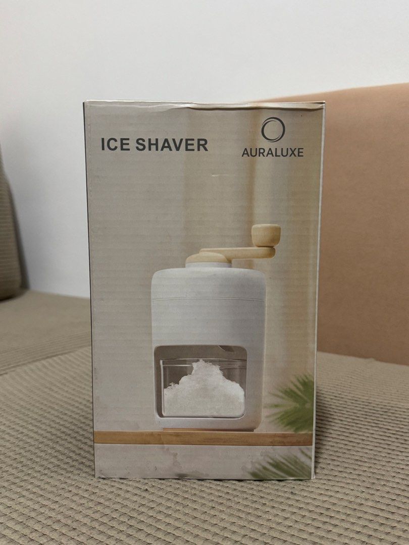 Auraluxe Ice Shaver (Category: Juicers, Blenders & Grinders) located in Manila. Submitted by kelbinooo (Listing ID 1465931022, Image 1). Description: - Brand: Auraluxe manual ice shaver machine - Colorway: Clean white with stylish brown handle components - Condition: Unused, opened only to take photos - Inclusions: Main body unit, clear collection container, inner mold cup, turning handle, and original retail box - Usage: Perfect for making cafe-