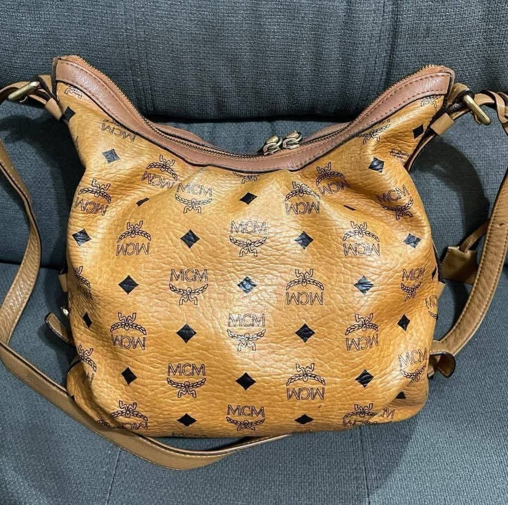 Authenric MCM Cognac Crossbody (Category: Shoulder Bags) located in Quezon City. Submitted by luxxechic (Listing ID 1465948467, Image 2). Description: turnable screw ykkzip with lock & key looks new no issue actual photo posted mop: gcash .