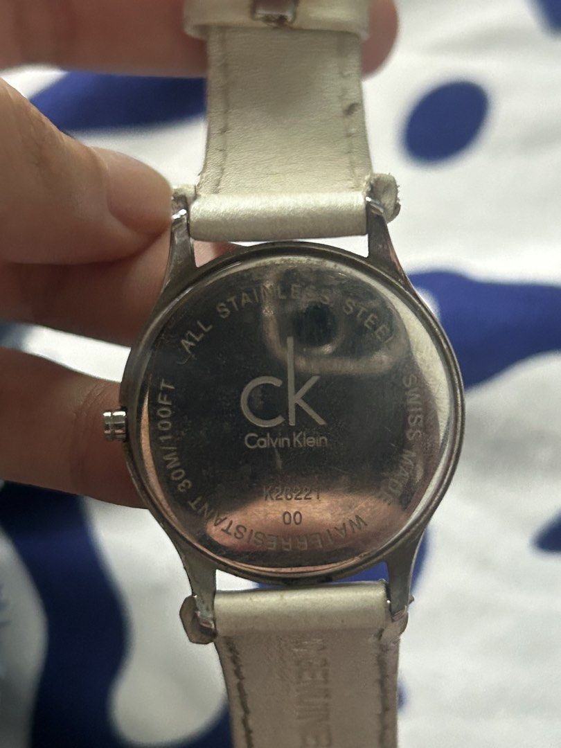 Authentic Calvin Klein K26221 * Swiss Made Watch (Category: Women's Watches) located in Bacoor. Submitted by fiercepenguin_c471dd (Listing ID 1465811628, Image 3). Description: - Brand: Calvin Klein (Model: K26221) - Movement: Swiss-made quartz - Display: Black face with clear 1-12 numbers, silver-tone stainless steel case - Strap: White genuine leather, comfortable fit - Water Resistance: Up to 30m (100 feet) - Style: Clean, minimalist look perf