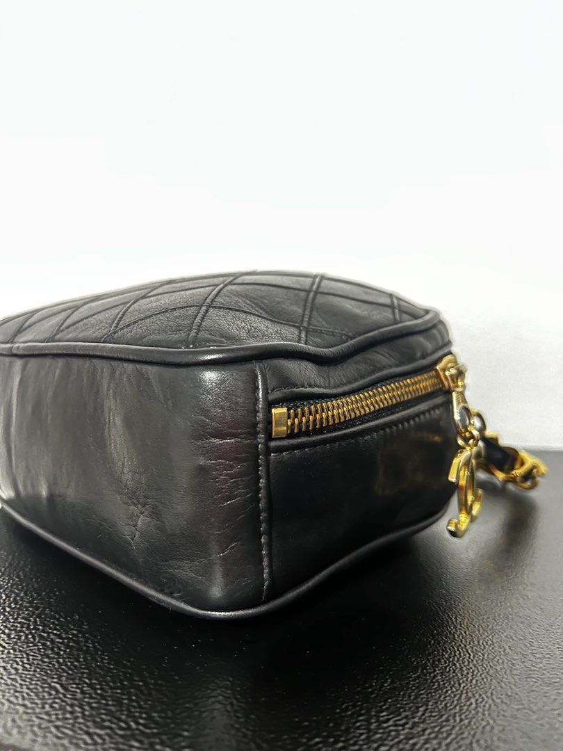 Authentic Chanel Diamond quilted matellasse coco charm half moon (Category: Luxury Bags & Wallets) located in Tacloban City. Submitted by classy_luxury (Listing ID 1465810484, Image 3). Description: Authentic Chanel Diamond Quilted Matellase coco charm Half moon Guaranteed authentic Black lambskin leather Vintage from 1986-1988 W 21.5 cm x H 16.5 cm x D 7cm Interior 2 zipped pockets, both runs fine. Great condition, nice and clean no peeling or s
