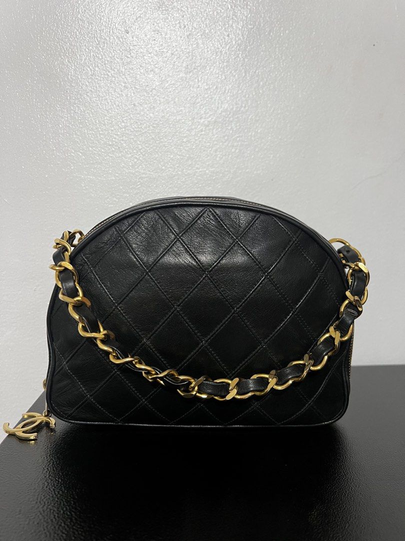 Authentic Chanel Diamond quilted matellasse coco charm half moon (Category: Luxury Bags & Wallets) located in Tacloban City. Submitted by classy_luxury (Listing ID 1465810484, Image 1). Description: Authentic Chanel Diamond Quilted Matellase coco charm Half moon Guaranteed authentic Black lambskin leather Vintage from 1986-1988 W 21.5 cm x H 16.5 cm x D 7cm Interior 2 zipped pockets, both runs fine. Great condition, nice and clean no peeling or s