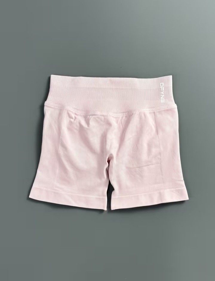 Authentic DFYNE Pink Butt Lifting Short (Category: Activewear) located in Binan City. Submitted by shopwme_vintage.com (Listing ID 1465903898, Image 2). Description: DFYNE Pink Butt-Lifting Shorts | Size M - Authentic DFYNE Shorts - Flattering butt-lifting / contouring fit - High-waisted design - Stretchy & comfortable material - Beautiful soft pink color - Size: Medium (M) Perfect for gym, workouts, or anyone who loves that snatched + sculpted l