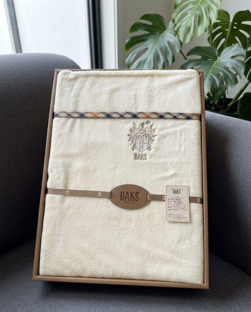 AUTHENTIC GAURANTEE 💯 DAKS LONDON BLANKET (Category: Bedding & Towels) located in Las Pinas. Submitted by outerwearsmanila (Listing ID 1465863927, Image 1). Description: A cream-colored DAKS London cotton fleece or pile bed sheet/blanket featuring the brand's signature. 📌WHY DAKS IS SO EXPENSIVE? DAKS London is expensive because it operates as a heritage British luxury fashion house with a reputation built over more than 130 years. 📌Royal Warr