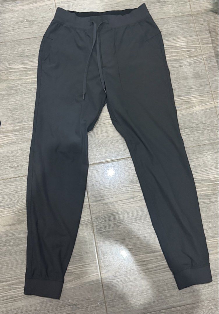 Authentic Lululemon Black Athletic Joggers Pants Size S (Category: Joggers) located in Iligan City. Submitted by jytomps (Listing ID 1465790446, Image 1). Description: - Brand: Lululemon - Color: Black - Size: Small - Material: 53% Elastomultiester, 47% Recycled Polyester - Features: Elastic waistband with drawstring, side pockets, cuffed ankles - Origin: Made in Bangladesh - Condition: Clean inside and out, great pre-loved condition.