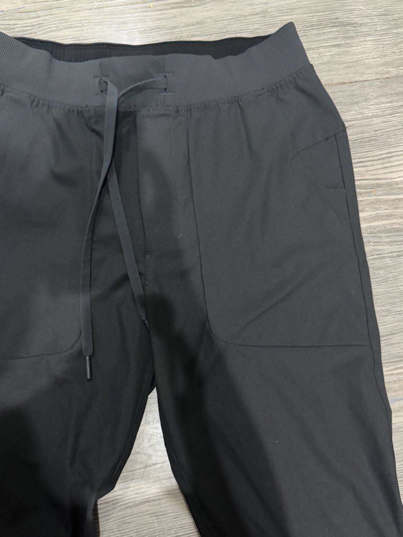 Authentic Lululemon Black Athletic Joggers Pants Size S (Category: Joggers) located in Iligan City. Submitted by jytomps (Listing ID 1465790446, Image 3). Description: - Brand: Lululemon - Color: Black - Size: Small - Material: 53% Elastomultiester, 47% Recycled Polyester - Features: Elastic waistband with drawstring, side pockets, cuffed ankles - Origin: Made in Bangladesh - Condition: Clean inside and out, great pre-loved condition.