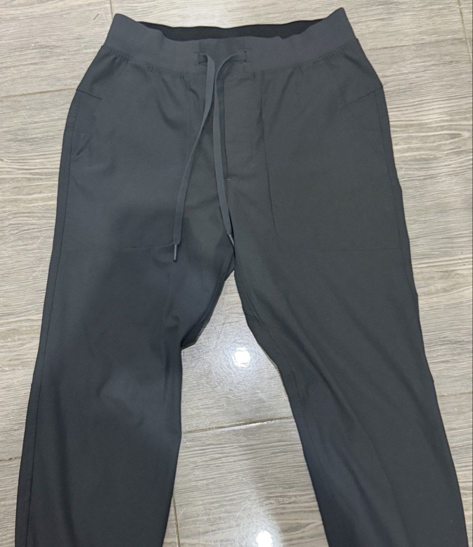 Authentic Lululemon Black Athletic Joggers Pants Size S (Category: Joggers) located in Iligan City. Submitted by jytomps (Listing ID 1465790446, Image 2). Description: - Brand: Lululemon - Color: Black - Size: Small - Material: 53% Elastomultiester, 47% Recycled Polyester - Features: Elastic waistband with drawstring, side pockets, cuffed ankles - Origin: Made in Bangladesh - Condition: Clean inside and out, great pre-loved condition.