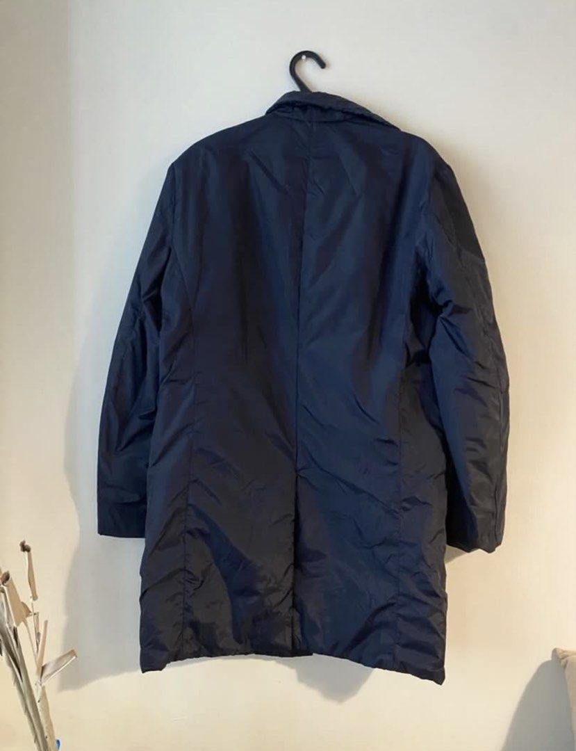 Authentic Prada 90s Buttoned Single-Breasted Nylon Coat (Category: Luxury Apparel) located in Mandaluyong City. Submitted by wear_your_style (Listing ID 1465812911, Image 2). Description: Bought preloved in Japan. Nylon material. Midnight blue but close to black ang color. Para siyang sports jacket na may konting padding. Perfect for Baguio/autumn weather but I used this is a topper during winter. Surprisingly magaan. Maraming pockets: 3 secret p