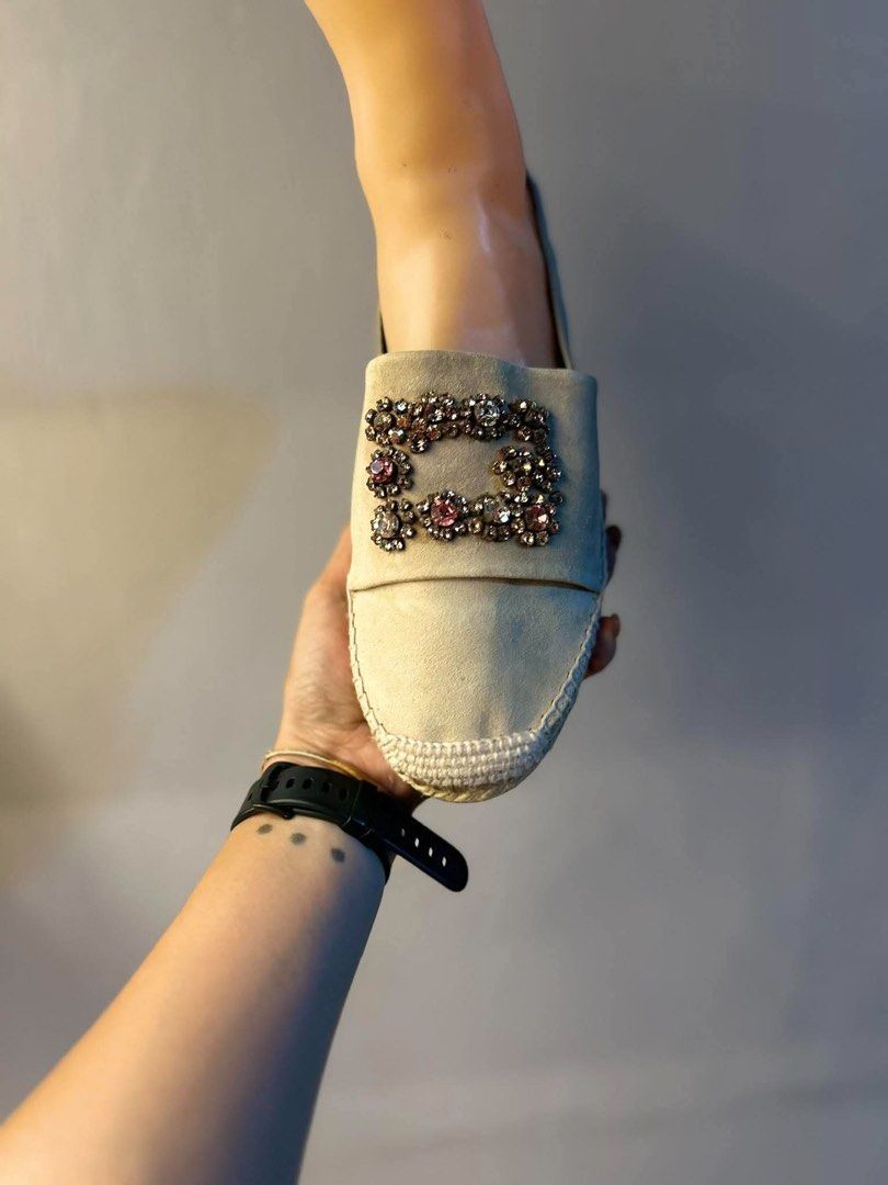 Authentic roger vivier espadrilles (Category: Shoe inserts) located in Manila. Submitted by maancutie04 (Listing ID 1465893542, Image 1). Description: - Material: Premium beige suede upper with woven jute sole trim and flat rubber bottom - Design: Easy slip-on style with a rounded toe - Feature: Eye-catching large crystal buckle embellished with sparkling pink and clear stones - Condition: Clean upper with very minimal wear on the soles - Perfect