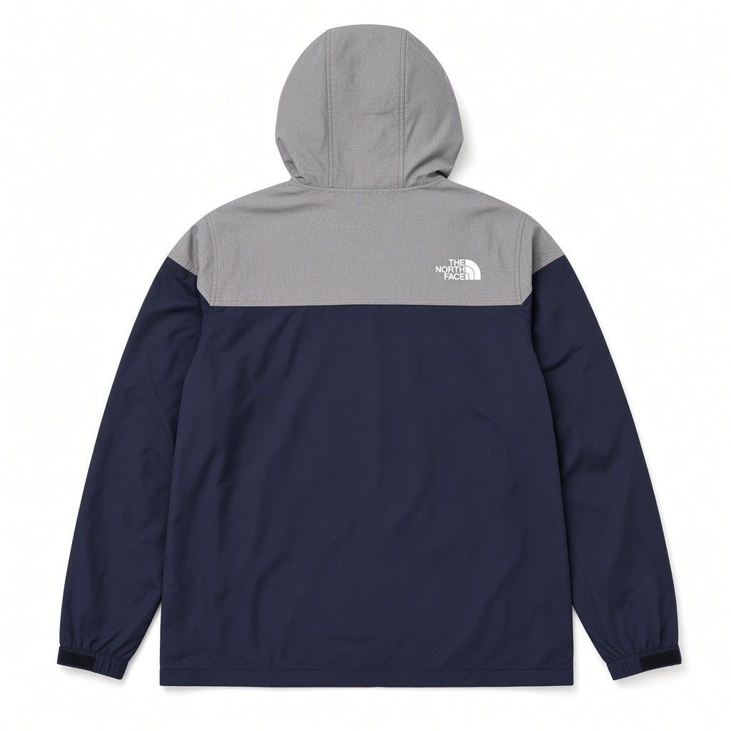 Authentic The North Face Korea Heritage Mountain Jacket (Category: Coats, Jackets and Outerwear) located in Saravia. Submitted by foundandfavedbcd (Listing ID 1465834806, Image 2). Description: - Brand: The North Face - Color: Navy blue and heather grey - Size: 95 (Medium) - Style: Button-up front with snap closures, drawstring hood, and two front pockets - Branding: White logo embroidery on chest and back shoulder - Condition: Pristine, zero fla