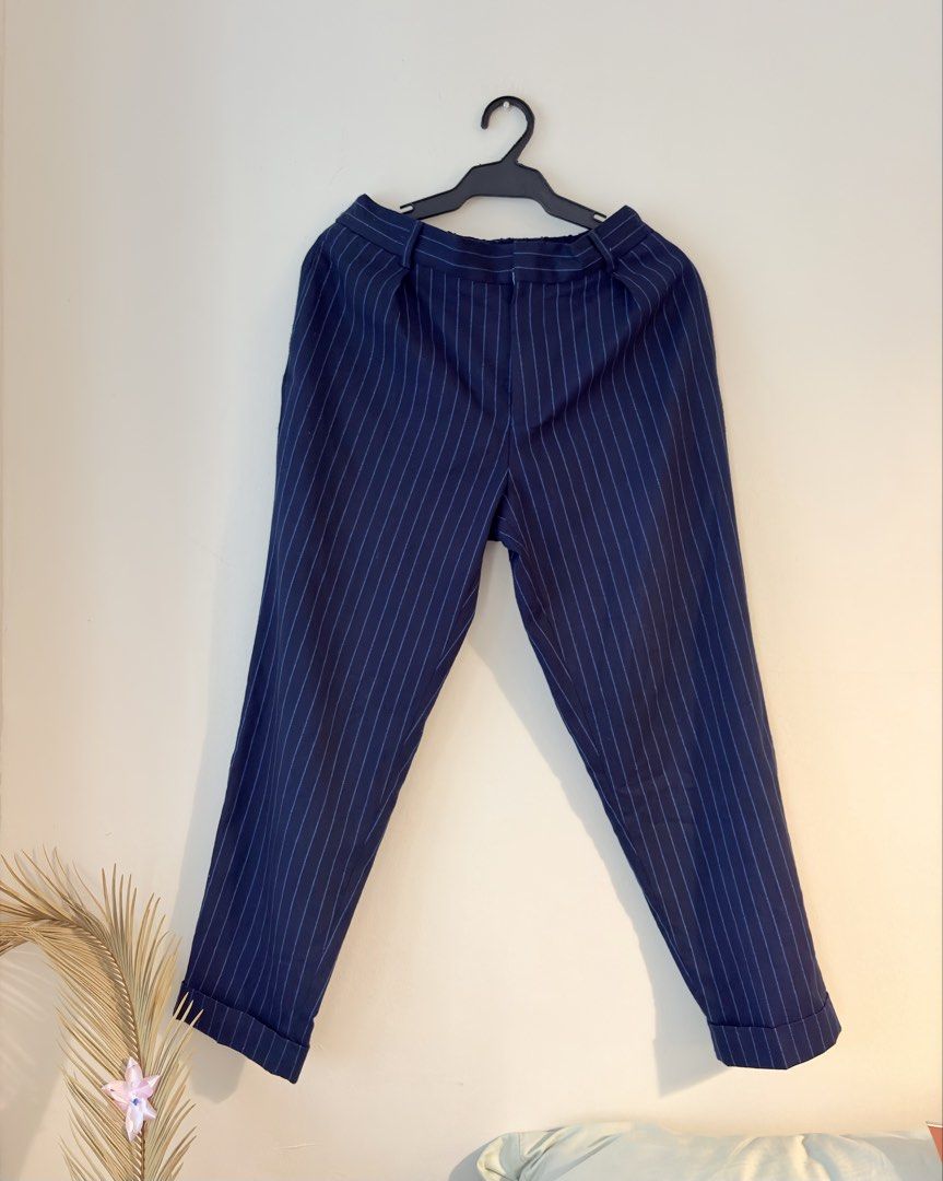 Authentic Topman Navy Blue Pinstripe Cuffed Pants (Category: Trousers) located in Mandaluyong City. Submitted by material_boi (Listing ID 1465837669, Image 1). Description: Store bought years ago. Made in Vietnam. Maganda. Malambot. Cuffed at the hem. Medyo tapered din siya. Size says 30S meaning 30 waistline but short inseam around 35 inches long. With garterized waistband so this can fir 29-31 inches waistline. Navy blue color, the pinstripes i