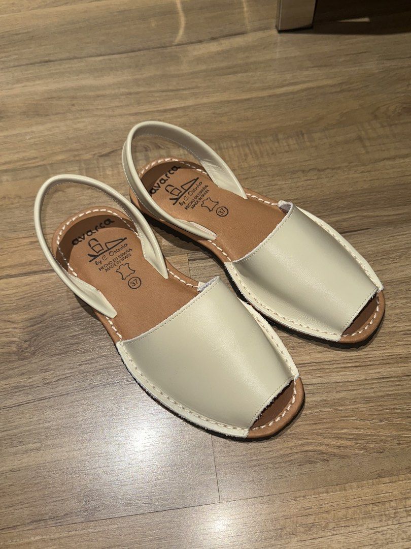 Avarca by C. Ortuño Leather Sandals (Category: Flats & Sandals) located in Manila. Submitted by yanaloyola_ (Listing ID 1465874991, Image 1). Description: - Authentic Avarca sandals handcrafted in Spain, bought in Barcelona (Sept 26) - Original price: 40 euros - Genuine leather upper in creamy off-white with contrasting tan footbeds - Classic Menorcan closed-toe style with a secure back strap - Size: 37 stamped inside - With clean stitching and a