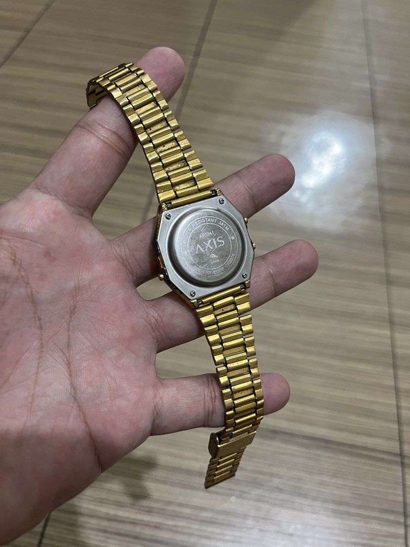 Axis AP3341 Gold Digital Watch (Category: Women's Watches) located in Makati City. Submitted by lilmissgirl (Listing ID 1465805382, Image 2). Description: - Brand/Model: Axis AP3341 vintage-style digital watch - Color: Classic gold tone with metal link bracelet and secure clasp - Functions: Clear digital display, alarm, and chronograph - Durability: Stainless steel back case with 30m water resistance - Power: Battery-operated (uses CR2016) - Cond