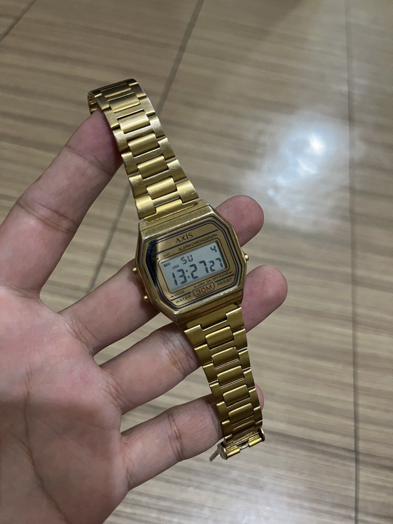 Axis AP3341 Gold Digital Watch (Category: Women's Watches) located in Makati City. Submitted by lilmissgirl (Listing ID 1465805382, Image 1). Description: - Brand/Model: Axis AP3341 vintage-style digital watch - Color: Classic gold tone with metal link bracelet and secure clasp - Functions: Clear digital display, alarm, and chronograph - Durability: Stainless steel back case with 30m water resistance - Power: Battery-operated (uses CR2016) - Cond