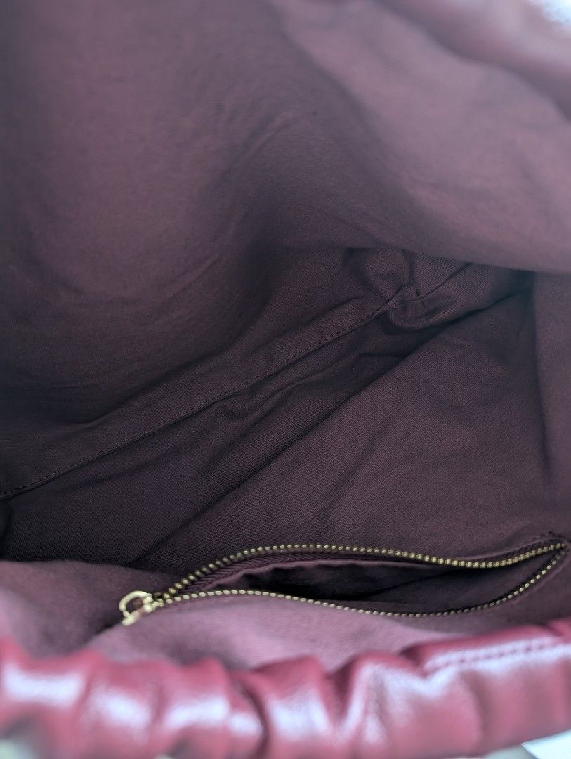 AZTRID Medium Dumpling Bag (Category: Shoulder Bags) located in Makati City. Submitted by g.jo.h (Listing ID 1465952932, Image 3). Description: used 2x only - Brand: AZTRID - Color: Rich Maroon - Material: Premium faux leather with gold-tone hardware - Design: Stylish gathered/pleated top opening with front logo lettering - Straps: Comfortable dual slim straps - Interior: Clean fabric lining with a convenient inner zip pocket and branded leather 