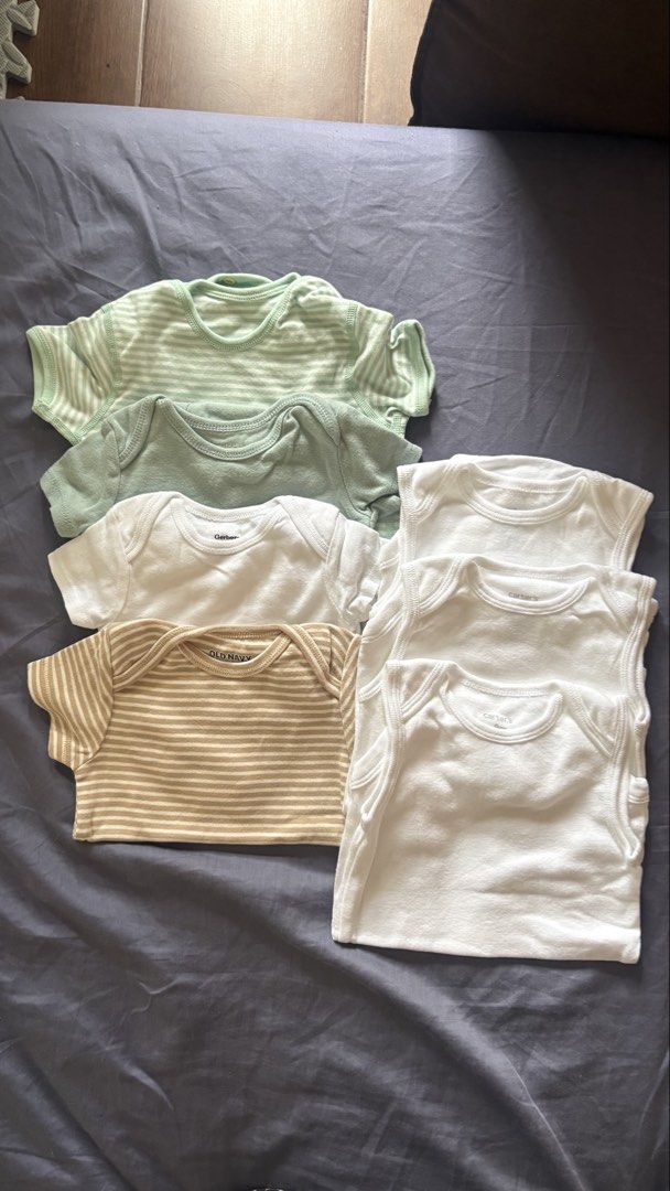Baby onesies Assorted (Category: Babies & Kids Fashion) located in Taguig. Submitted by trashpalace_ (Listing ID 1465840358, Image 1). Description: - Bundle of assorted baby bodysuits 500 peso take all Short sleeve and sando - Colors: White, green stripes, solid green, and beige stripes - Brands: Gerber, Old Navy, and Carter's - Material: Soft 100% cotton - Condition: Great basic pieces for everyday wear -never worn, RFS decluttering .