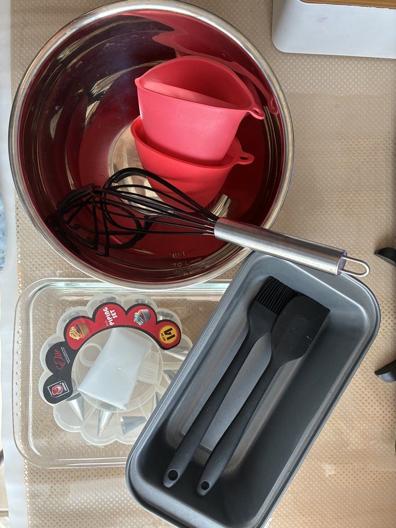 Baking tools bundle with mixing bowls, piping set and utensils (Category: Bakeware) located in Manila. Submitted by jhie24 (Listing ID 1465799139, Image 1). Description: Everything you need to start baking at home in one convenient bundle! - 2 stainless steel mixing bowls with measurement marks - Elite piping set with nozzles and bag - 2 Heat-resistant red silicone pinch mitts - Black silicone spatula and basting brush - Durable wire whisk - 2 Pr