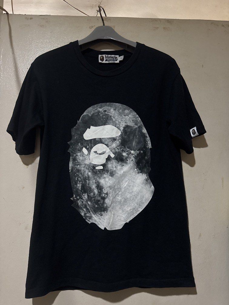 Bape Big Head Tee (Category: Tshirts & Polo Shirts ) located in Danao, Cebu. Submitted by welvirinec29053 (Listing ID 1465777342, Image 1). Description: This appears to be a black A Bathing Ape (BAPE) Mid-Autumn Festival special edition graphic t-shirt featuring an ape head filled with a moon surface texture. size small dimes 18x26 color 9.8/10.
